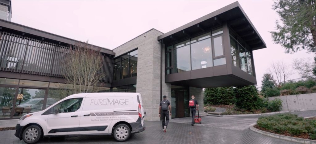 Stunning mansion in Vancouver with two Pure Image technicians approaching, and a Pure Image van in the background