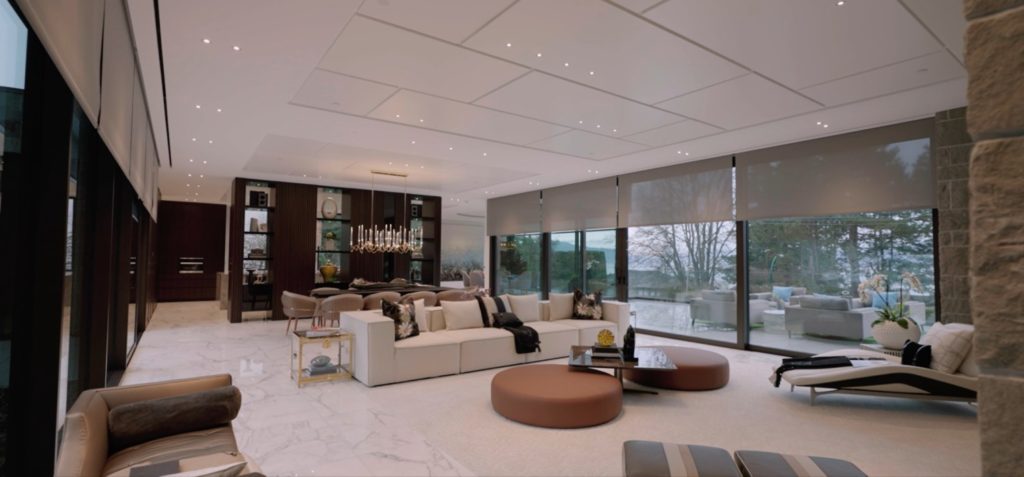 Luxury Vancouver living room with Lutron motorized shades, lighting control and integrated audio by Pure Image Calgary AB
