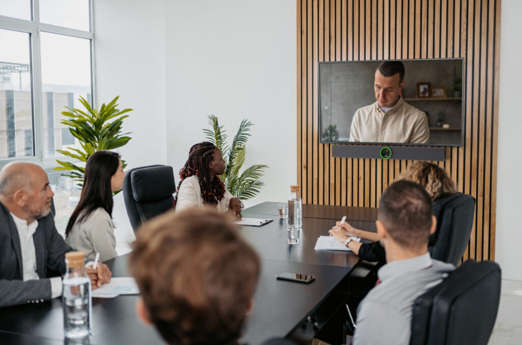 Crestron-powered meeting room in Vancouver featuring a soundbar with an integrated camera for video conferencing and AV control