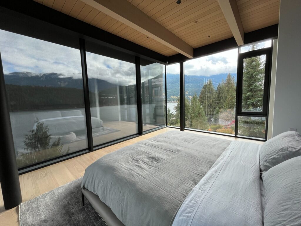 Beautiful Whistler home overlooking Green Lake, with Crestron motorized blinds providing seamless light control and stunning views