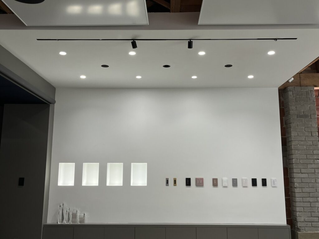 Lutron Ketra and HomeWorks display at the Pure Image showroom, featuring an array of Ketra lighting including the new Rania D2, along with a selection of HomeWorks keypads