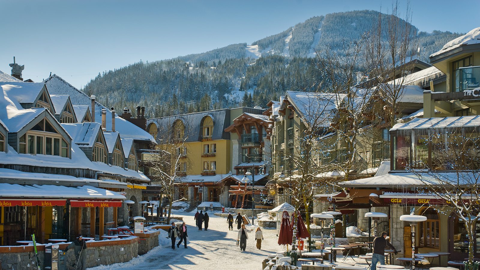 Whistler Village in winter, timber-clad buildings under snow