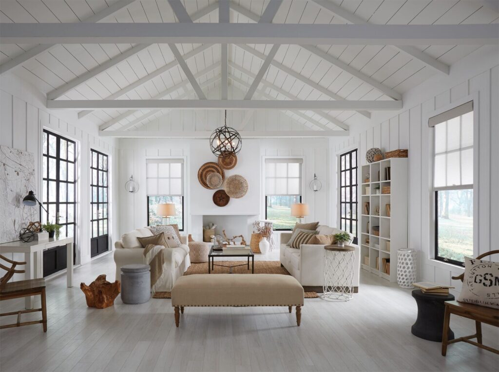 Lutron shades elegantly complement the sleek, modern design of this white-colored home, offering seamless integration with the home's smart automation system. Providing optimal light control, privacy, and energy efficiency, these shades enhance the minimalist aesthetic while offering a comfortable and sophisticated living environment.