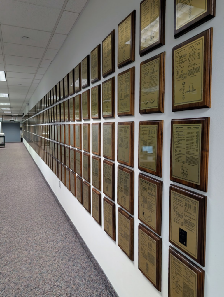 Crestron headquarters in New Jersey, showcasing innovation in smart home technology with walls lined with hundreds of patents, reflecting their continuous development and testing of advanced smart home automation systems.