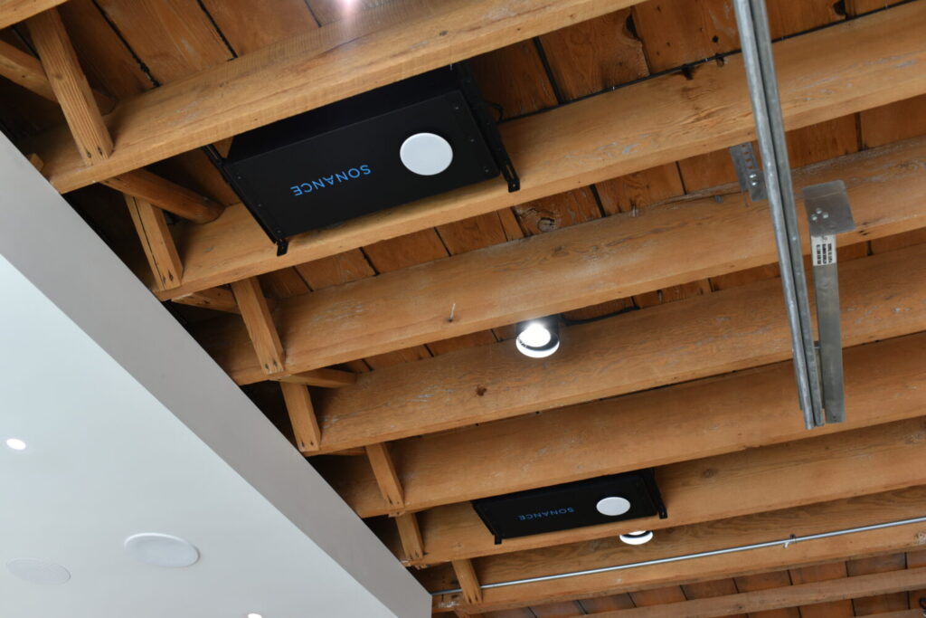 Pure Image Yaletown showroom featuring Sonance small-aperture speakers, combining exceptional sound quality with minimalist design for clients who demand both performance and aesthetics.