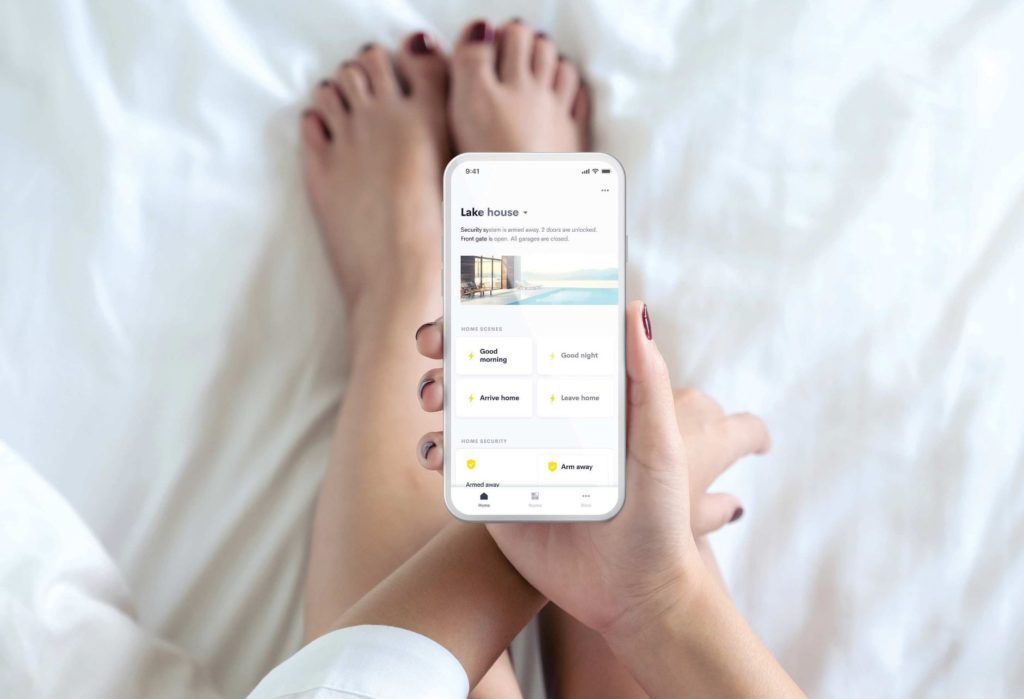 Crestron smart home interface showing unified control of lighting, audio-video systems, security, and climate, providing seamless automation and convenience for luxury homes.