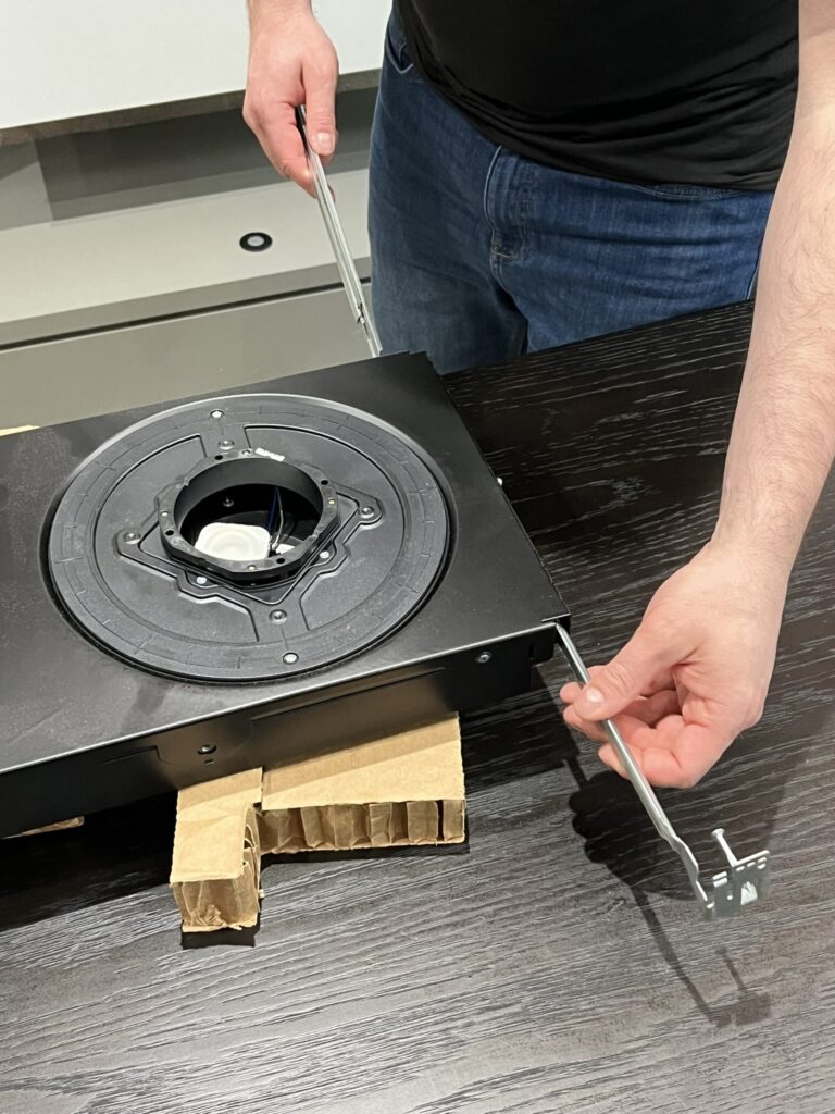 The Pure Image team carefully assembles Ketra D2 and Rania downlights before installing them into the ceiling. This preparation ensures each fixture meets exacting standards for performance and fit, setting the stage for a flawless, high-end lighting experience.