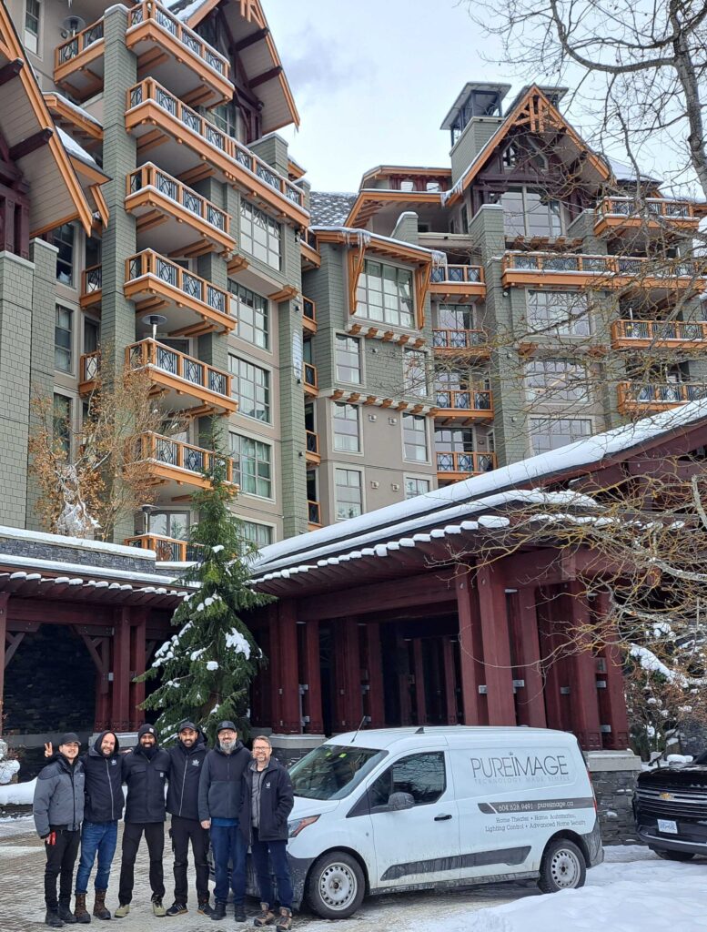 Pure Image team at a hospitality project in Whistler with branded service van, delivering Crestron and Lutron smart technology solutions.