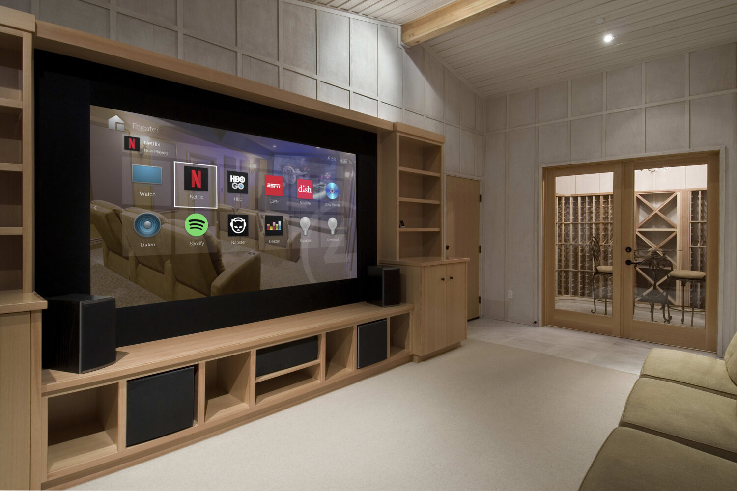 Luxury home theatre with tiered seating and a large screen