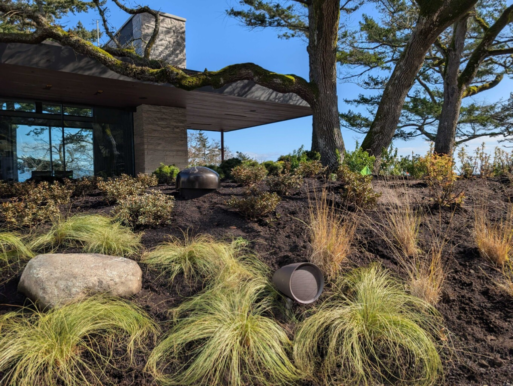 Beautiful Sonance Landscape Speakers in the beach house on Vancouver Island. Installation done by Pure Image Technology company, experts in smart home solutions.