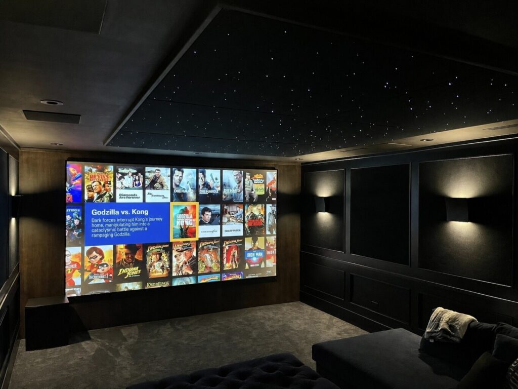 Custom luxury home theatre in Whistler with fibre optic star ceiling, large format projection screen, Kaleidescape movie server and ambient wall lighting, installation, design and service done by Pure Image Technology Whistler