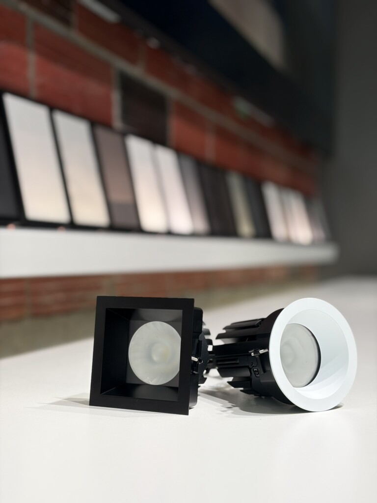 Ketra D2R square and round remodeler downlights on display at Pure Image Vancouver showroom alongside Lutron motorized shade fabric samples — Ketra retrofit lighting installation Vancouver BC
