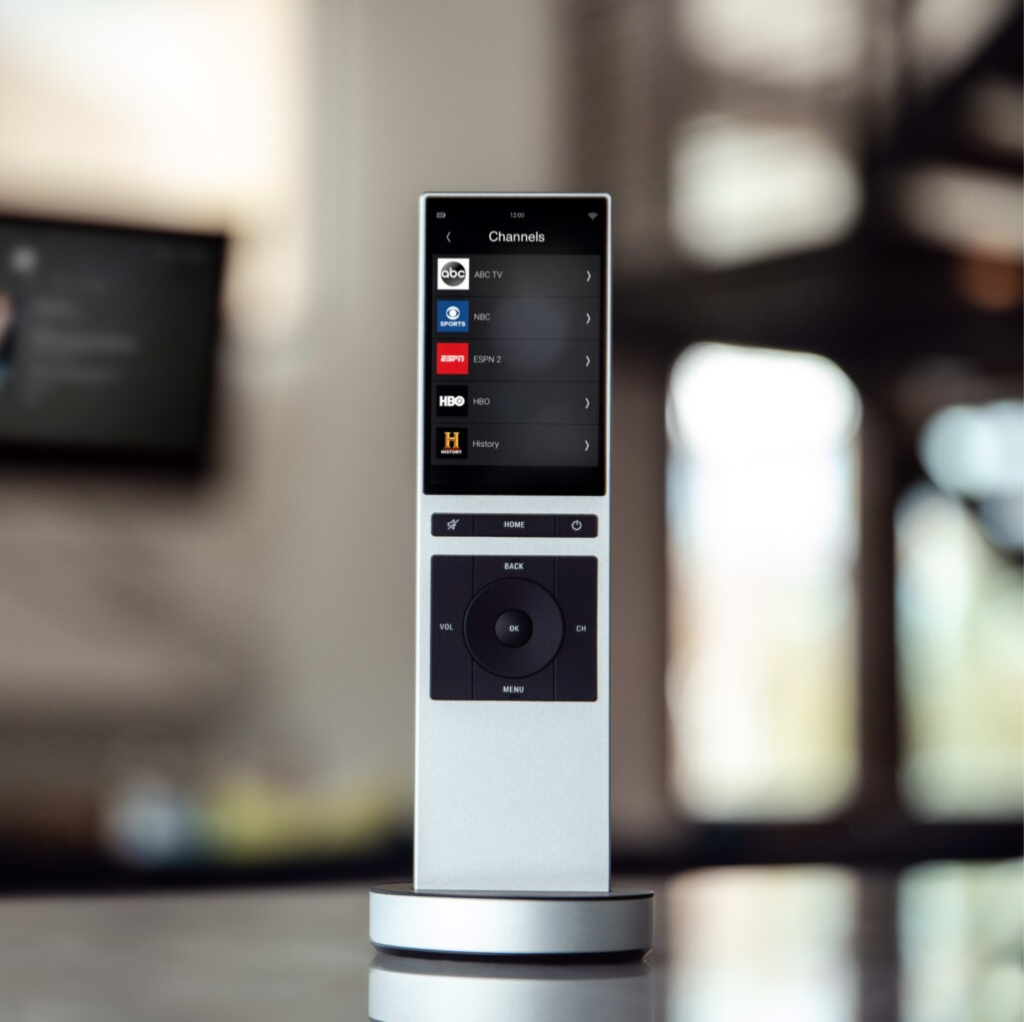 Control4 handheld remote control for luxury home theatre — intuitive one-touch control for audio, video and lighting by Pure Image home theatre installation Vancouver BC