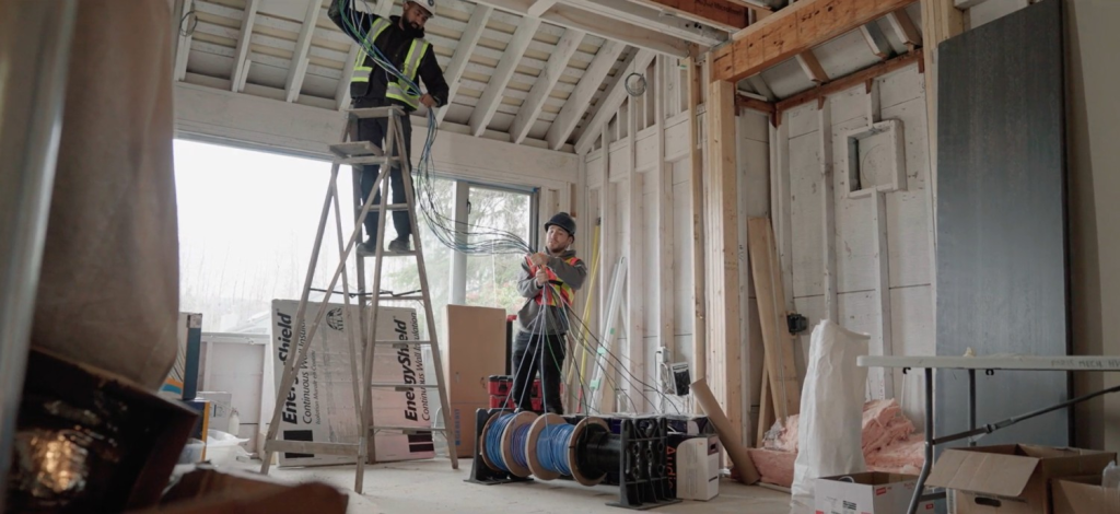 Pure Image certified technicians running premium cabling and wiring during luxury home theatre installation in Vancouver BC — professional home theatre installation by Pure Image Technology