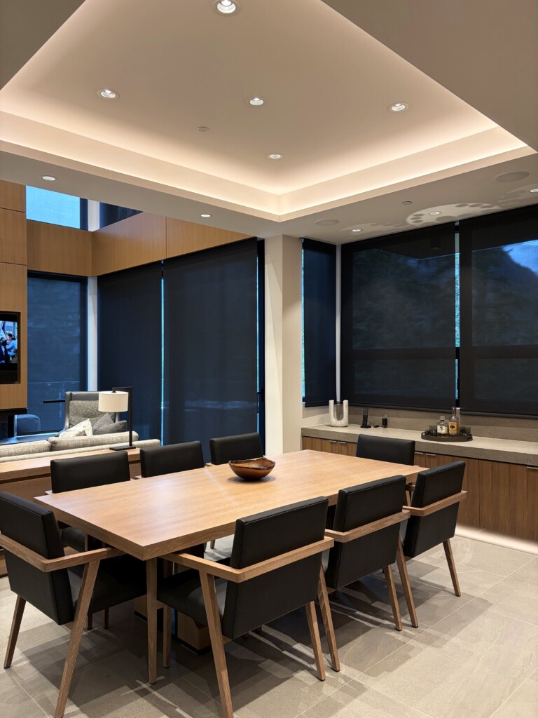 Motorized Window Coverings by Lutron in a luxury residence in Whistler. Sheer fabric offers privacy, energy efficiency and seamlessly integrates into the living area design.
