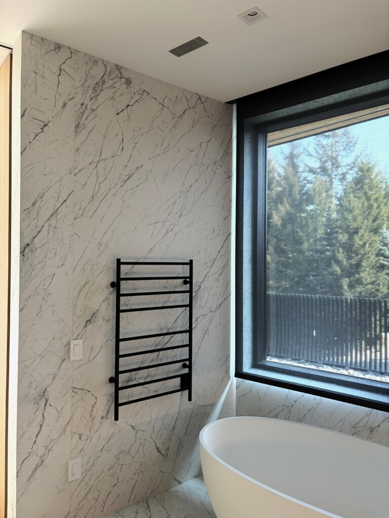 Professionally installed Lutron motorized shade by Pure Image in private residence in Whistler with enough light and privacy throughout the day and night.