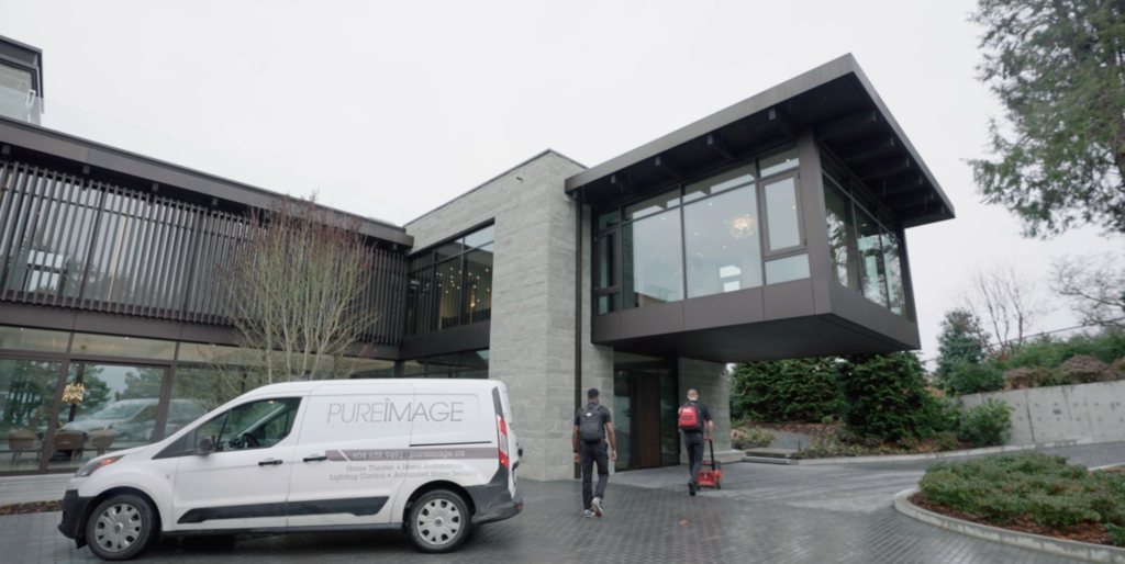 Pure Image dedicated Service Team walking towards a luxury home in Vancouver to provide exceptional service and support to Pure Image client