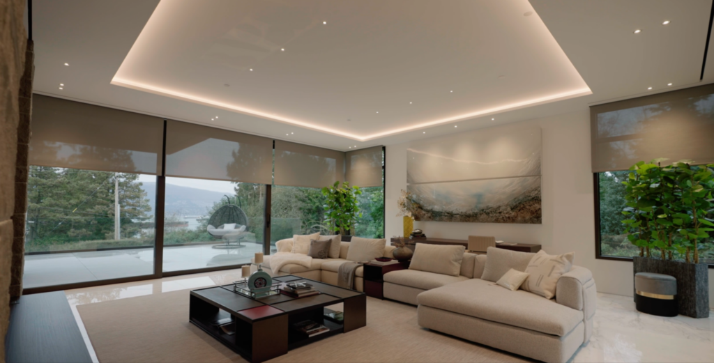 Luxury Living Room in Vancouver showcasing Lutron Lighting and Motorized Window Covering for extra comfort and luxury feeling - Smart Home Integrator Pure Image Vancouver BC