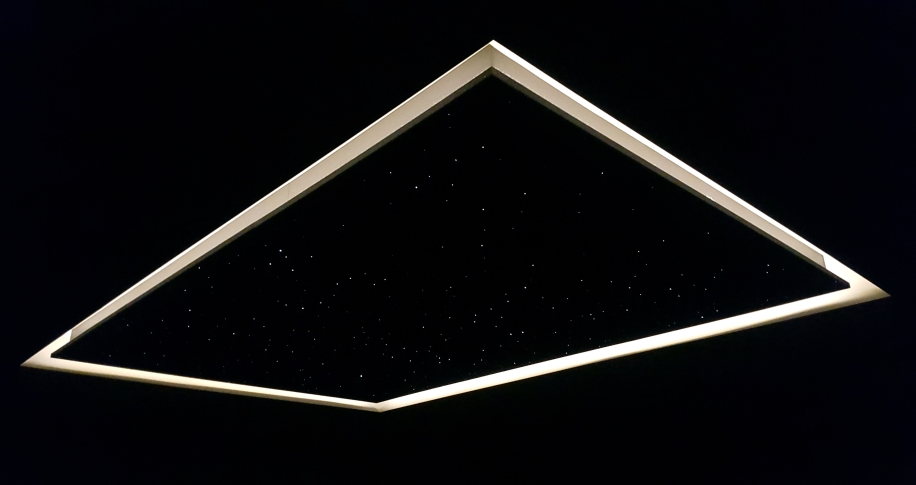 Custom fibre optic star ceiling with LED halo perimeter lighting in luxury home theatre in Vancouver — handcrafted star ceiling design and installation by Pure Image Vancouver BC