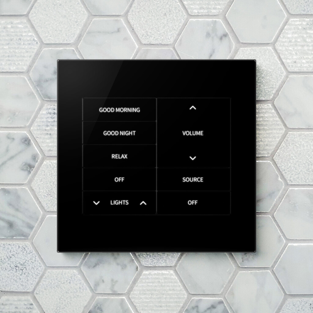 Crestron Horizon keypad in black glass with custom engraving, mounted flush in a tiled wall